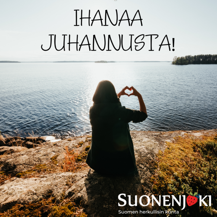 naisen hahmo järvenrannalla näyttää käsillä sydäntä. Teksti: Ihanaa juhannusta! Alakulmassa kaupungin logo